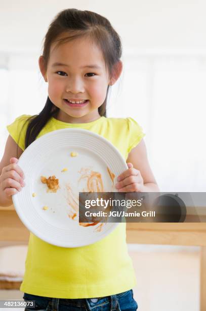 korean girl showing cleared plate - empty plate stock pictures, royalty-free photos & images