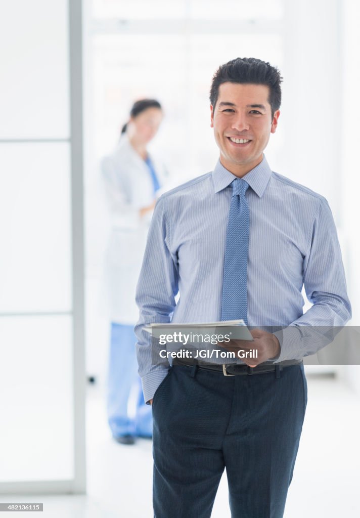 Businessman smiling in hospital