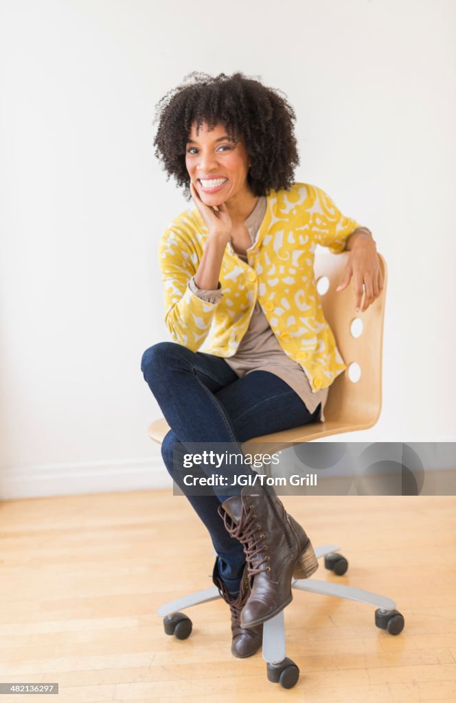 African American woman sitting in office chair