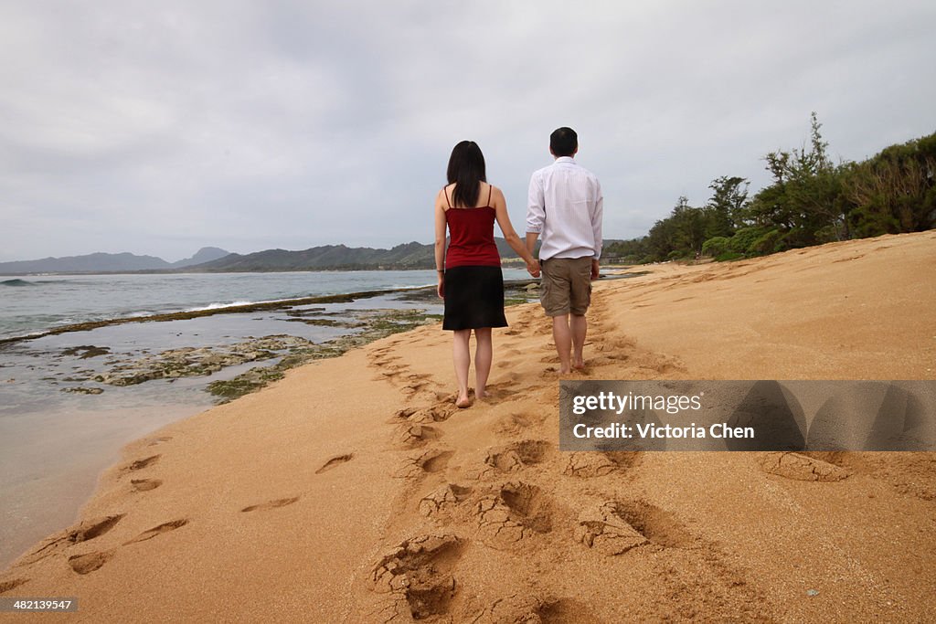 A Couple Walking Beach in Hawaii