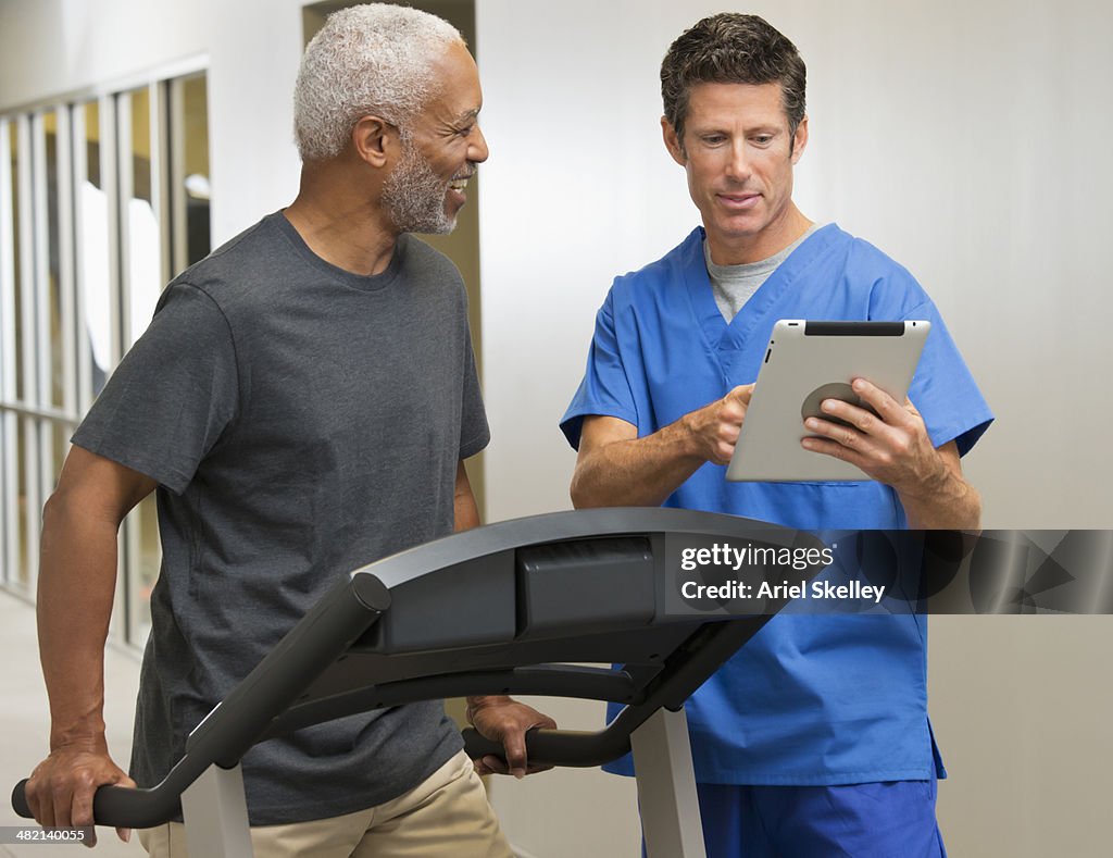 Nurse talking to patient in physical therapy
