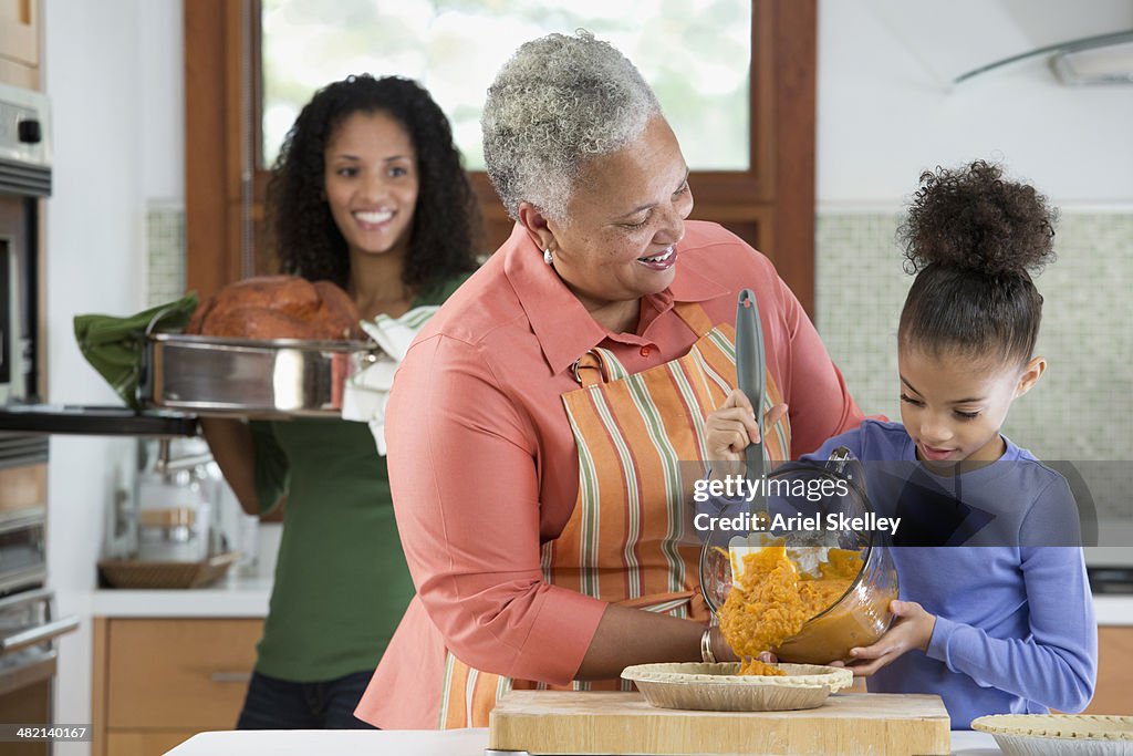 Three Generations Of Black Women Cooking In Kitchen High-Res Stock ...