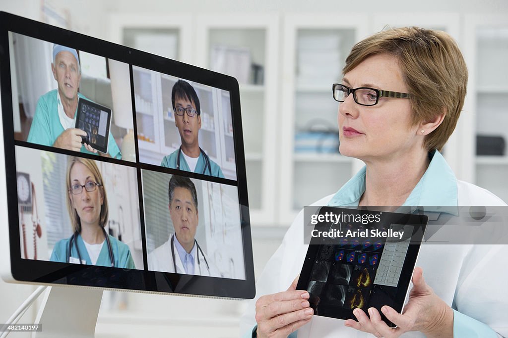 Doctors talking in video conference in hospital