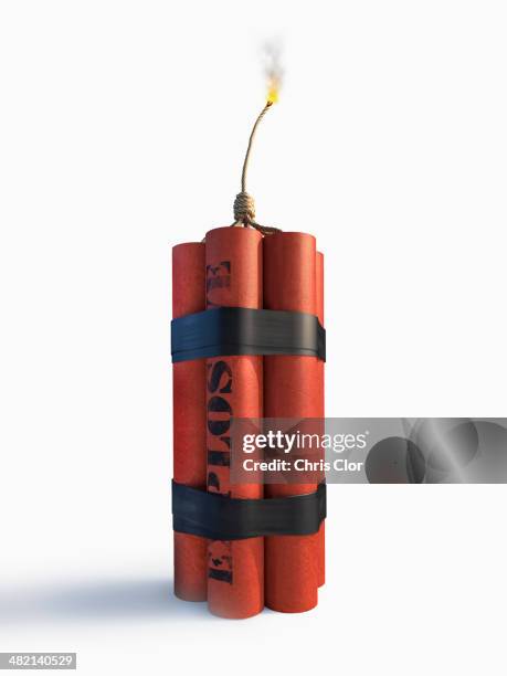 lit bundle of dynamite - explosives stock pictures, royalty-free photos & images