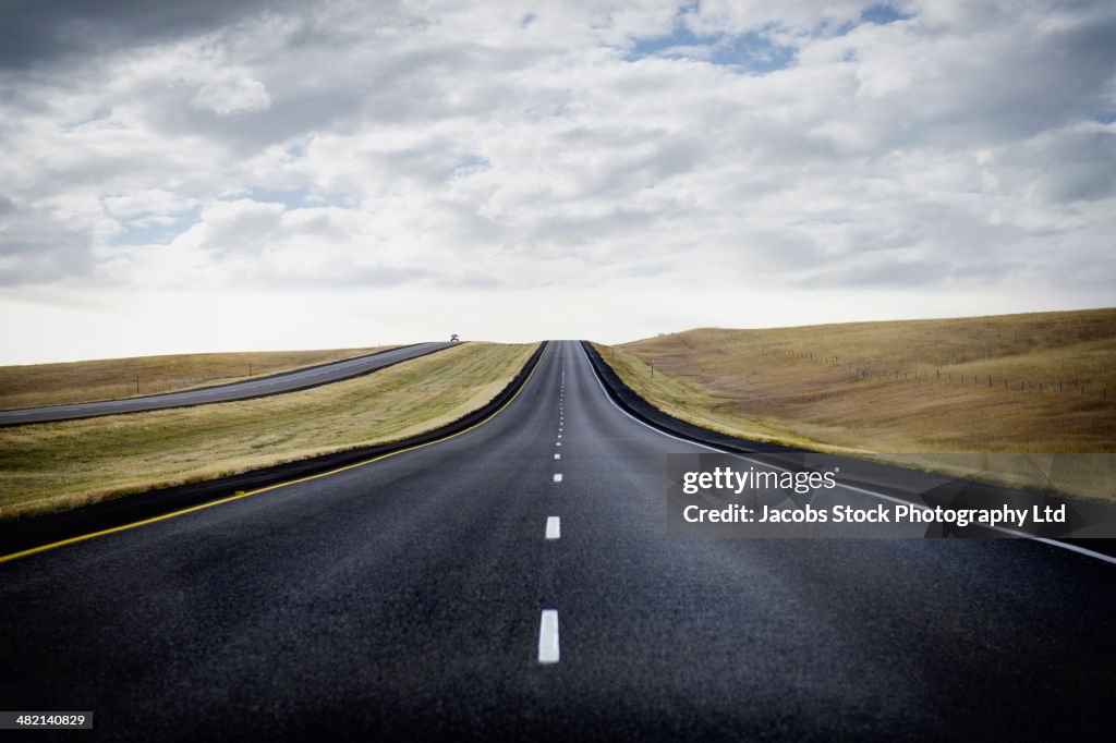 Paved road through rural landscape