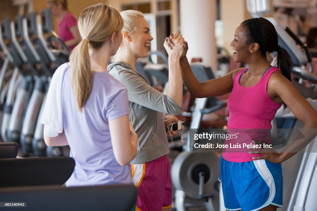 Women cheering in gym