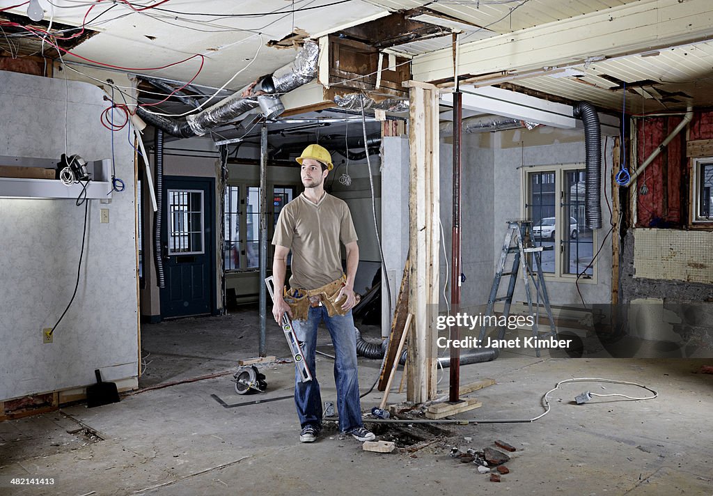 Caucasian construction worker in hard hat on site