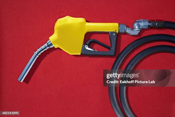 close up of gasoline pump nozzle - industrial hose stockfoto's en -beelden