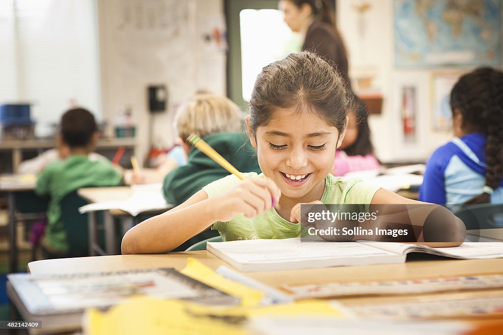 Hispanic student working in class