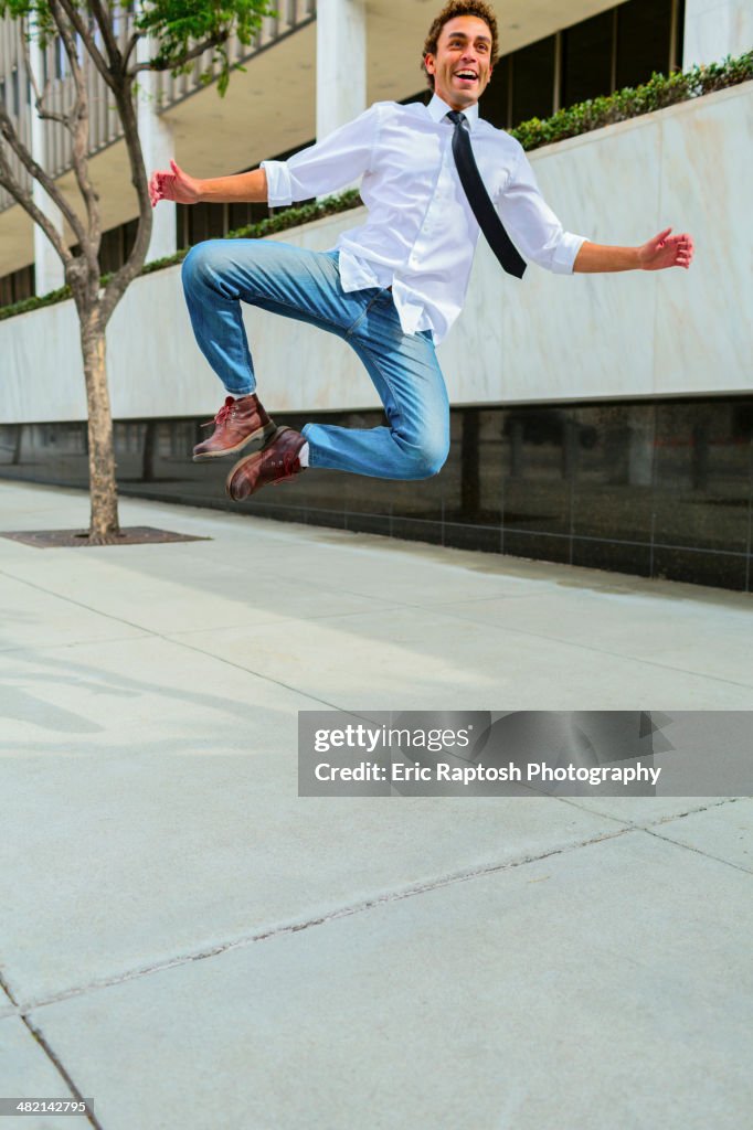 Hispanic businessman clicking his heels