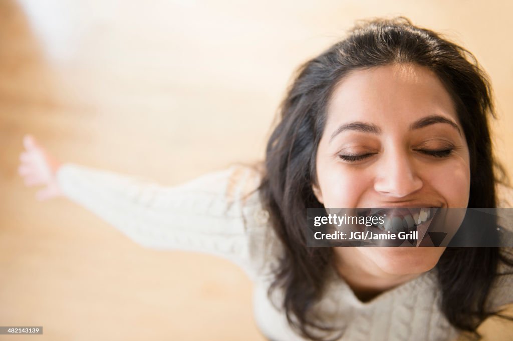 Close up portrait of carefree Asian woman with eyes closed