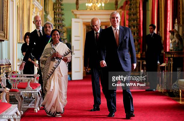 Prince Andrew, Duke of York walks with West Bengal Chief Minister Mamata Banerjee as he hosts a tea for those responsible for assisting with the...