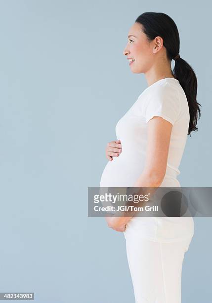 profile of pregnant japanese woman - black hair isolated stock pictures, royalty-free photos & images