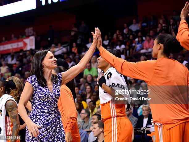 Sandy Brondello of the Western Conference All Stars hi fives her players during the Boost Mobile WNBA All-Star 2015 Game at the Mohegan Sun Arena on...