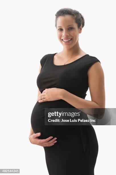 portrait of pregnant mixed race woman - pregnant isolated stock pictures, royalty-free photos & images