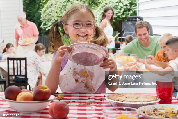 caucasian girl covered in pie at picnic - eating competition stock pictures, royalty-free photos & images