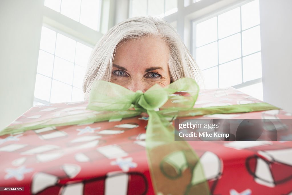 Close up portrait of Caucasian woman with Christmas gift