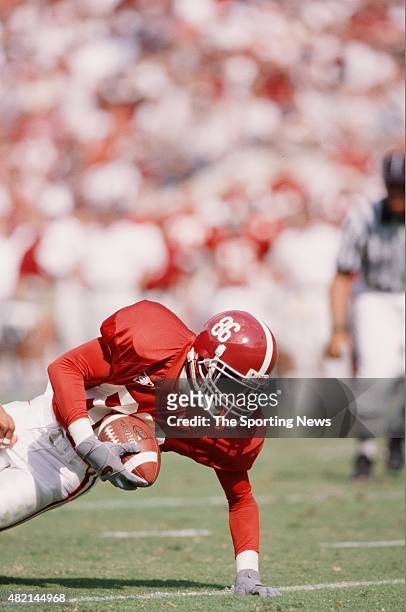 Michael James of the Alabama Crimson Tide dives with the ball against the South Carolina Gamecocks on September 30, 2000.