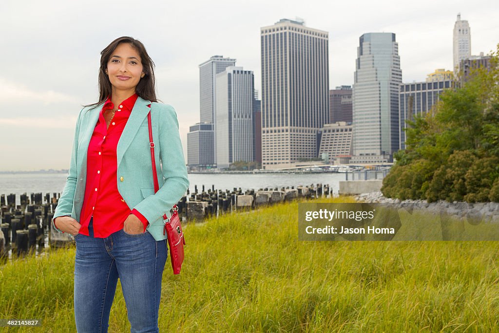 Mixed race woman smiling in park, New York, New York, United States