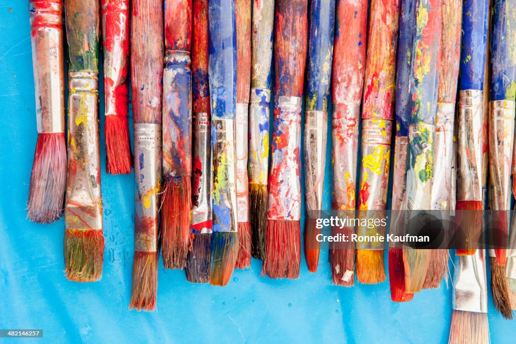 Close up of painter's messy brushes