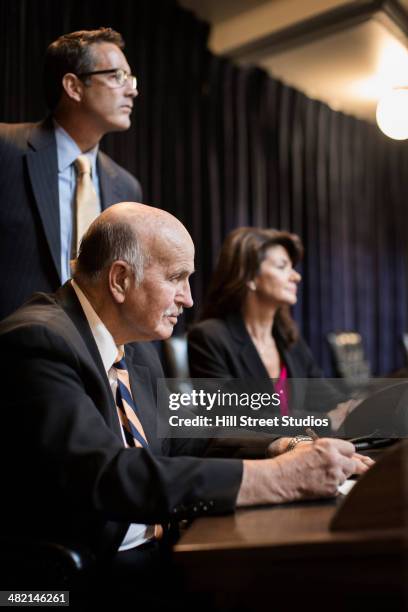 caucasian politician debating in chamber - council chambers stock pictures, royalty-free photos & images