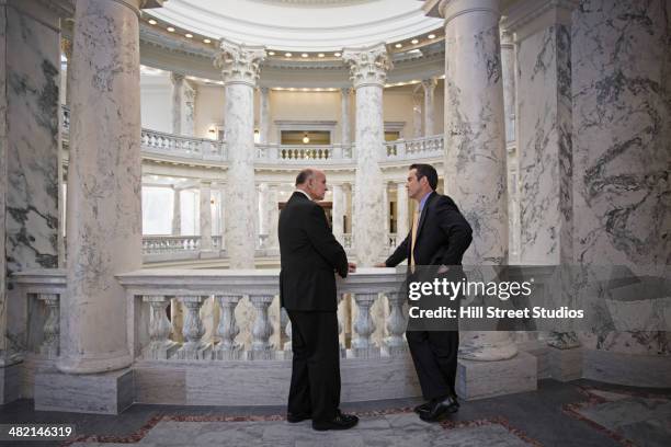 caucasian politicians talking in government building - collaboration government stock pictures, royalty-free photos & images