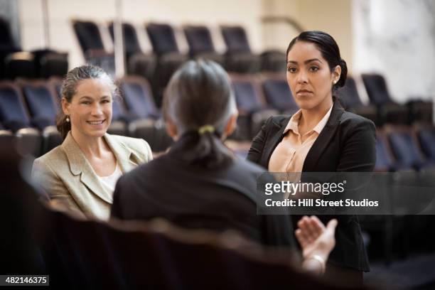 politicians talking in chamber - politics stock pictures, royalty-free photos & images