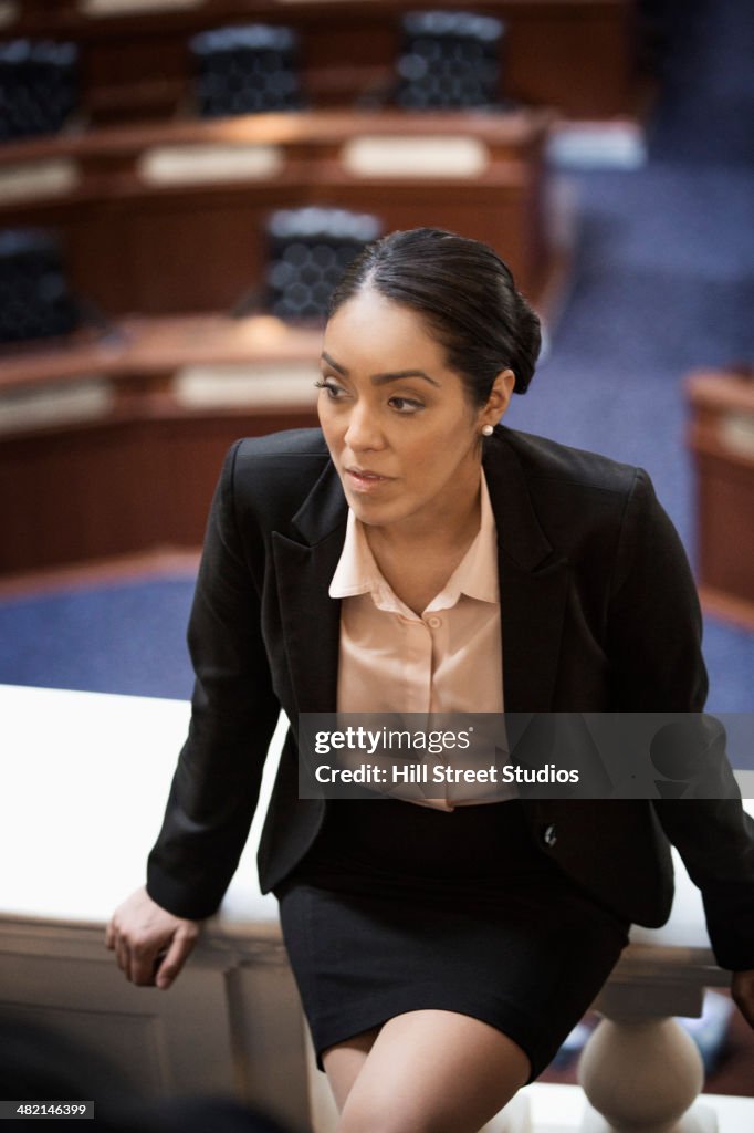 Hispanic politician sitting in chamber