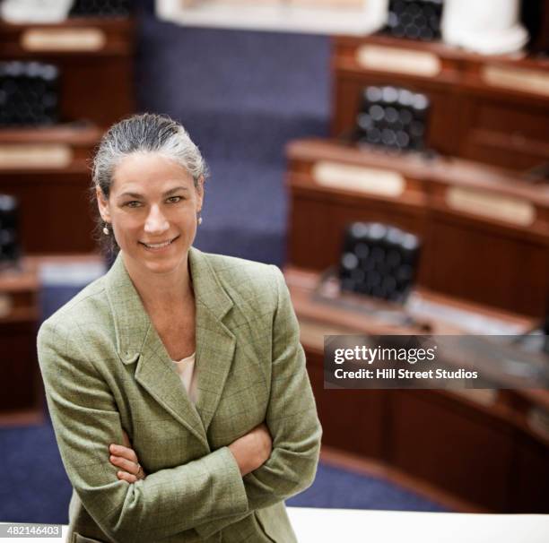 caucasian politician smiling in chamber - local government official stock pictures, royalty-free photos & images