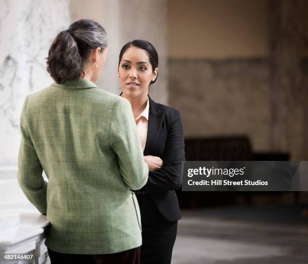 politicians talking in government building - government official stock pictures, royalty-free photos & images