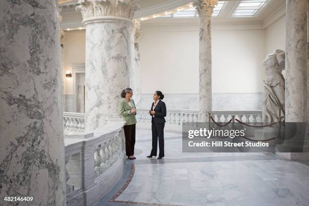 politicians talking in government building - local government official stock pictures, royalty-free photos & images