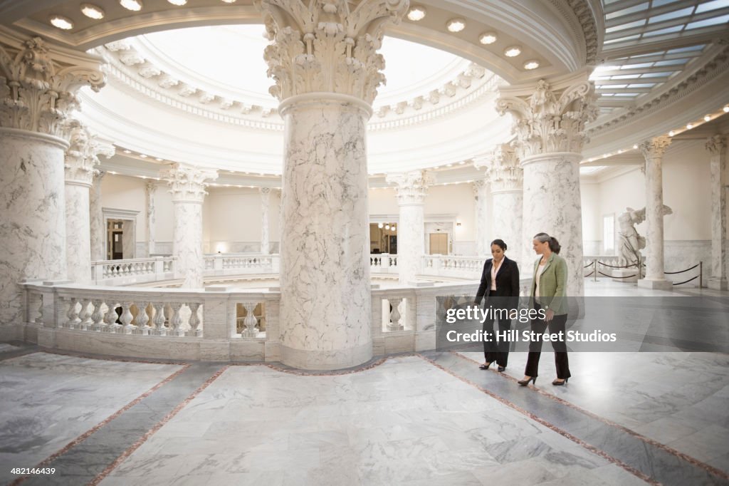 Politicians talking in government building