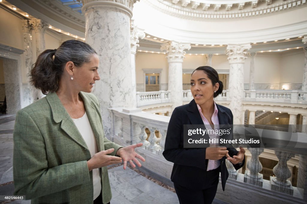 Politicians talking in government building