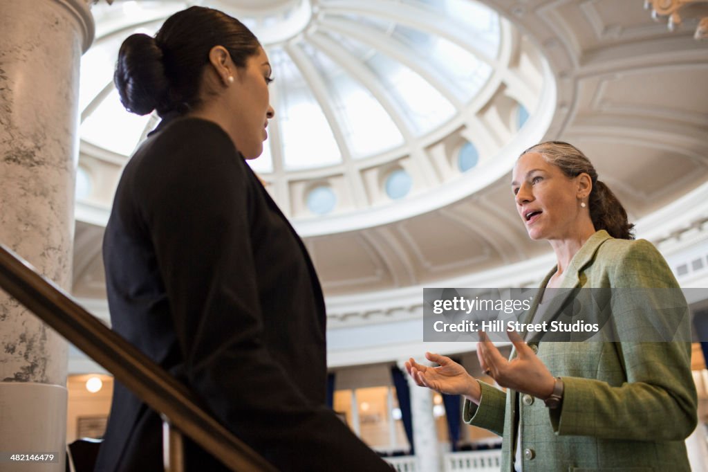 Politicians talking in government building