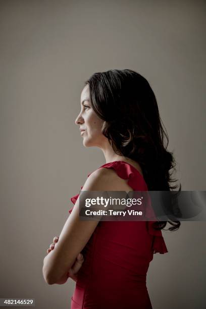 pensive hispanic woman looking away - hispanic man profile hopeful stock-fotos und bilder