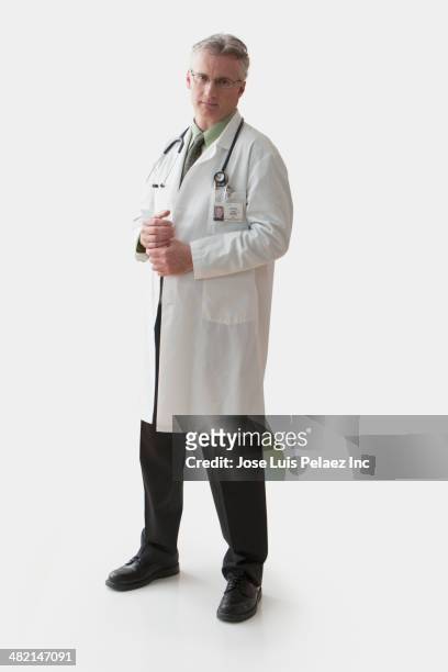 caucasian doctor in lab coat - doctor lab coat stock-fotos und bilder
