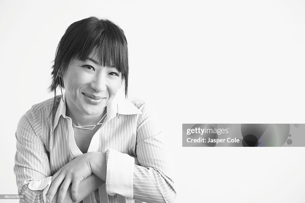 Mixed race businesswoman smiling