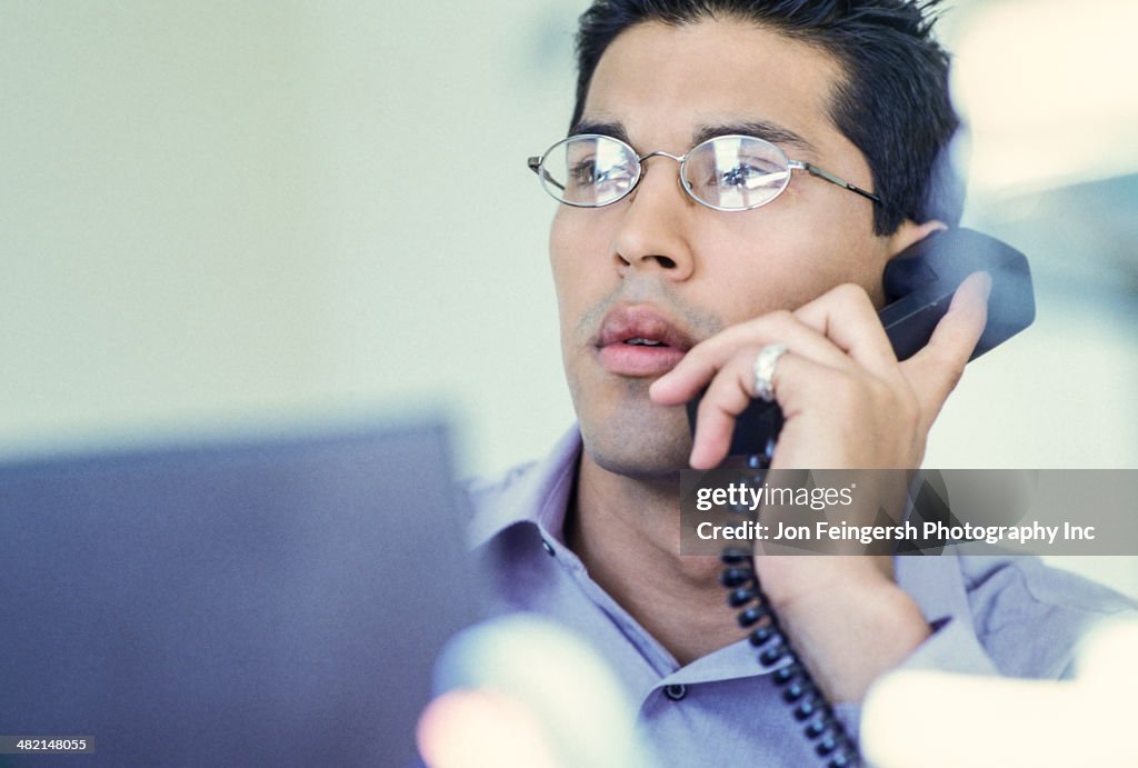 Businessman talking on telephone