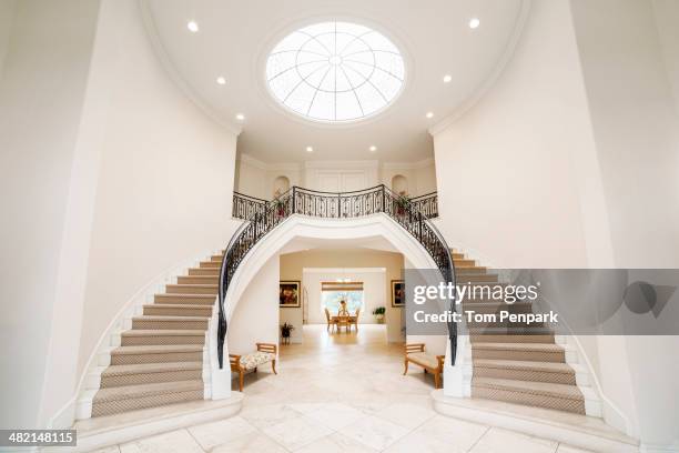 double staircase in ornate home - capital architectural feature - fotografias e filmes do acervo