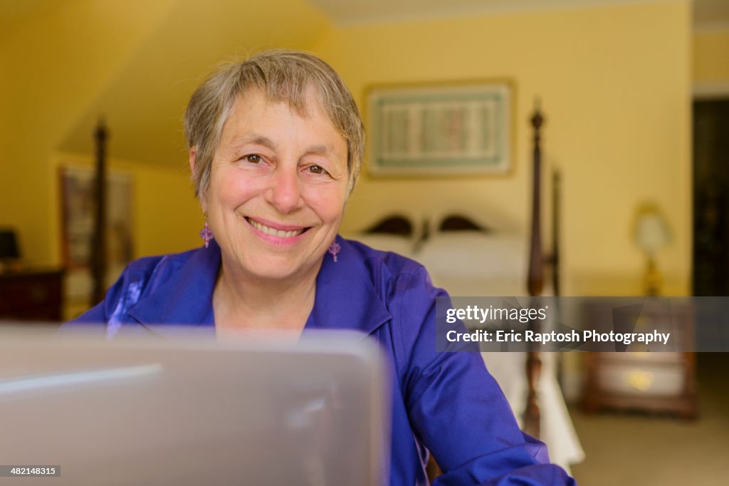 Senior Caucasian woman using laptop