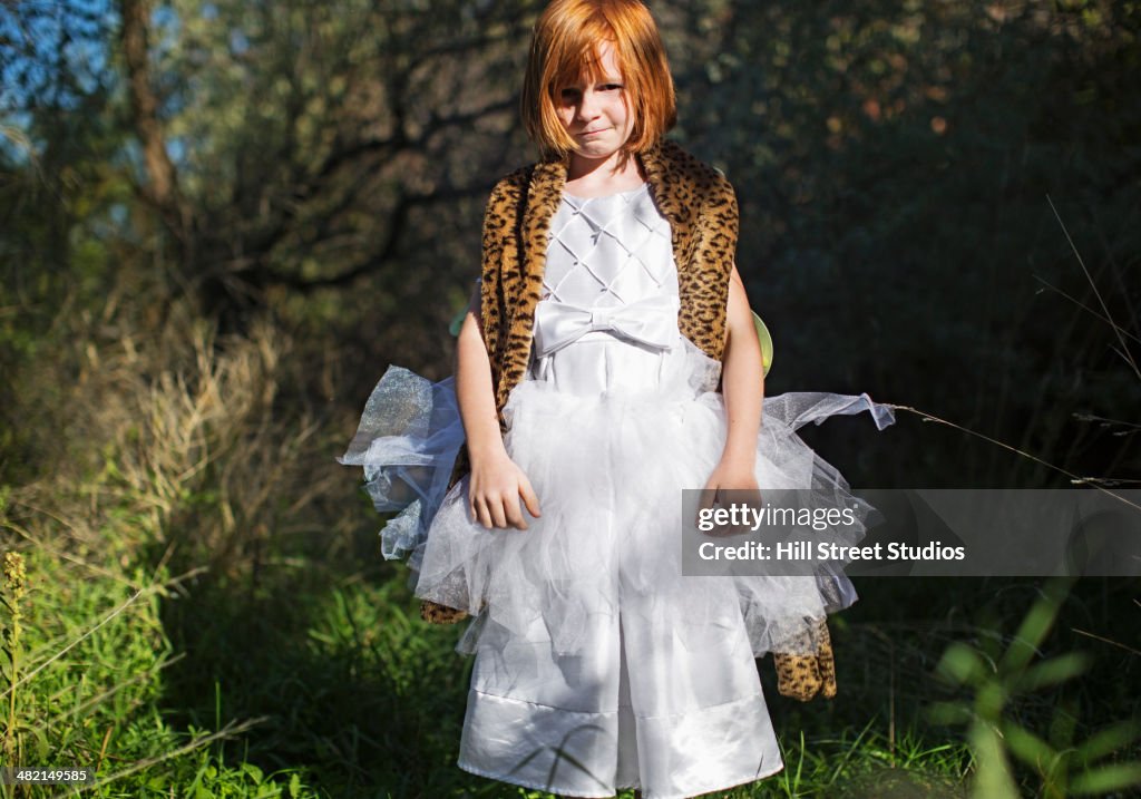 Portrait of Caucasian girl in costume outdoors