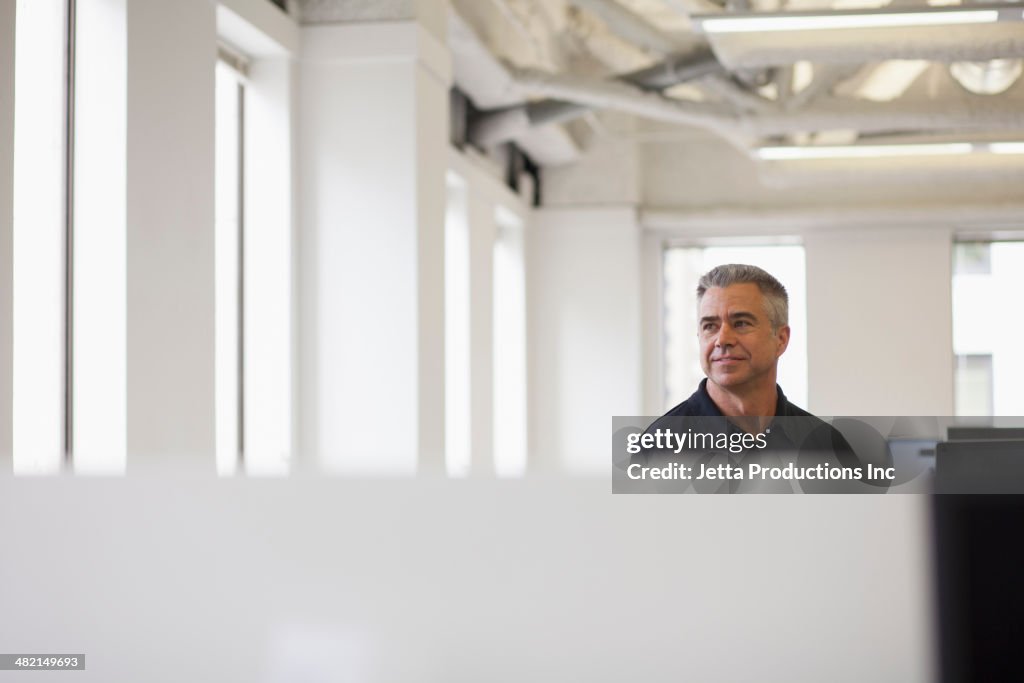 Caucasian businessman standing in office