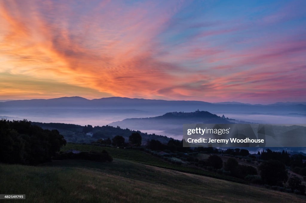 Sunrise over hills and town, Todi, Umbria, Italy
