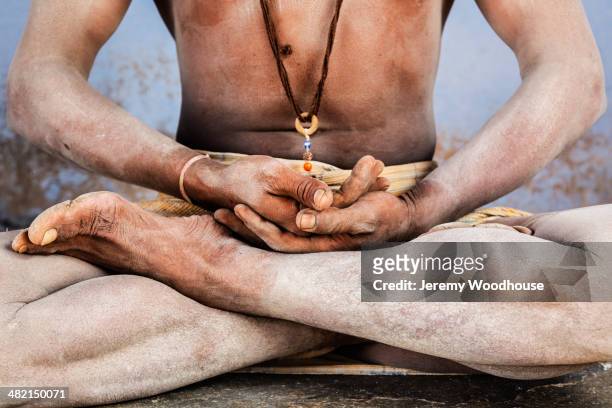 close up of sadhu in lotus position - jeremy chan stock pictures, royalty-free photos & images
