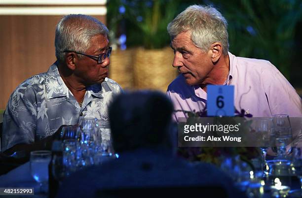 Secretary of Defense Chuck Hagel talks to National Defense Secretary of The Philippines Voltaire Tuvera Gazmin during a dinner he hosted for his...