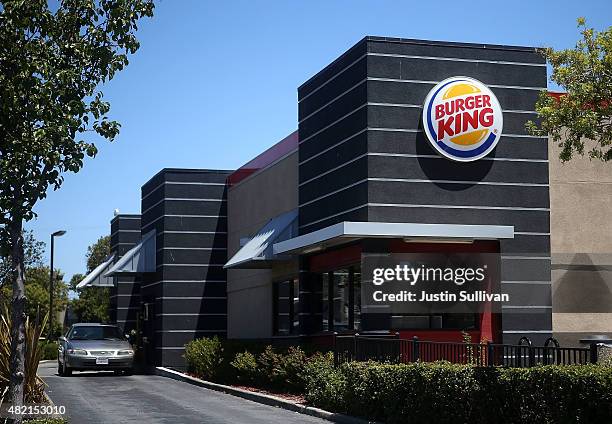 Car sits in the drive-thru at a Burger King restaurant on July 27, 2015 in San Rafael, California. Burger King parent company Restaurant Brands...