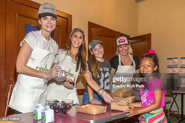 Betsy Brandt, Samantha Harris, Lola Ray Facinelli and Jennie Garth serve lunch to kids at the Feeding America: Say No To Summer Hunger Event In...