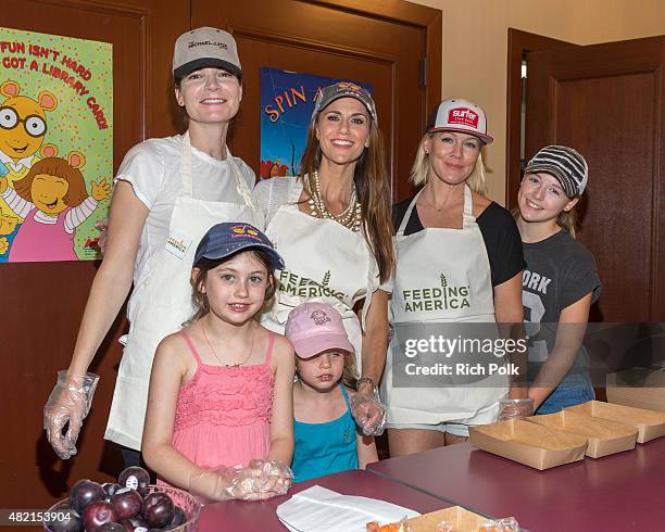 Betsy Brandt, Samantha Harris, Lola Ray Facinelli, Jennie Garth, Hillary Madison Hess , and Josselyn Sydney Hess serve lunch to kids at the Feeding...