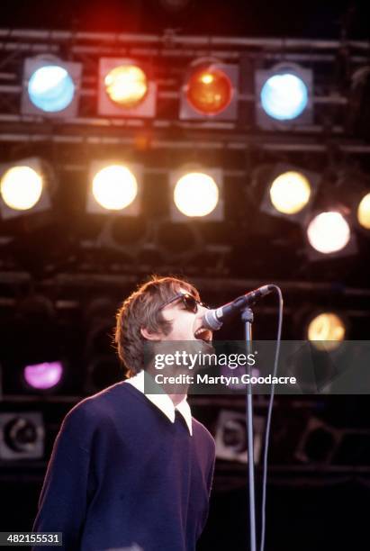 Liam Gallagher performs on stage with Oasis at Glastonbury Festival, United Kingdom, 1994.