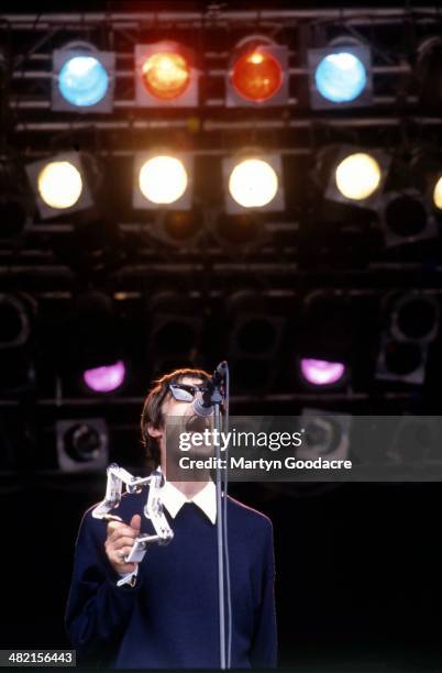 Liam Gallagher performs on stage with Oasis at Glastonbury Festival, United Kingdom, 1994.